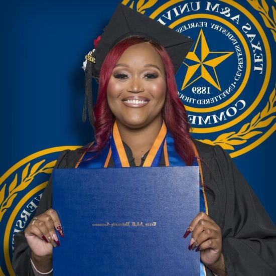 A headshot photo of a college graduate in cap and gown